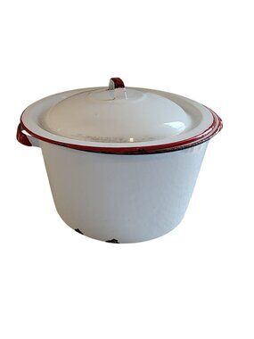 vintage white enamelware stock pot with red trim and a matching lid. 